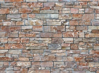 Rustic stone wall made of natural rock blocks of different size, Colors are brown,red and gray. Background and texture.