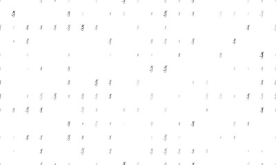 Seamless background pattern of evenly spaced black football soccer symbols of different sizes and opacity. Vector illustration on white background