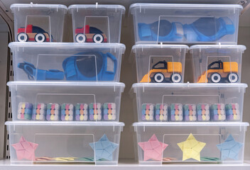 Transparent plastic containers with children's toys.