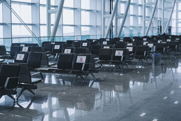 Airport passenger lounge and passangers waiting in Izmir Adnan Menderes Airport. Editorial shot in Izmir Turkey.