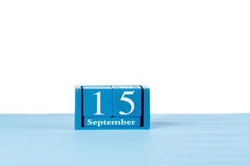 Wooden calendar September 15 on a white background