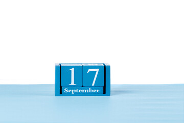 Wooden calendar September 17 on a white background