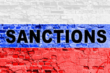 Obraz premium Sanctions against Russia. Russian flag on a textured brick wall
