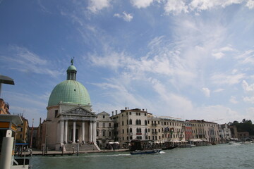 Fototapeta na wymiar The domed building by the Venetian canal.