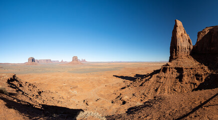 Panorama of Monument Valley on a bright sunny day in Arizona.