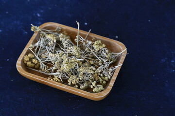 Yarrow herbal teas in the spoon. 
