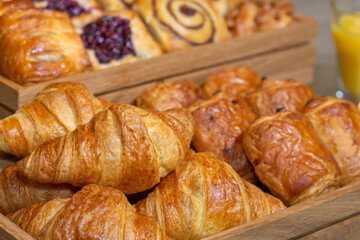 A delicious selection of continental breakfast pastries including croissants, cinnamon swirls and pain au chocolat