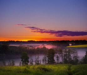 A beautiful spring morning in the Northern Europe rural area. Seasonal scenery during sunrise.