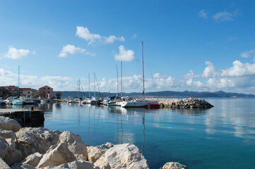 Coastal village Bibinje close to Zadar in Croatia, marina with moored sailboats - obrazy, fototapety, plakaty