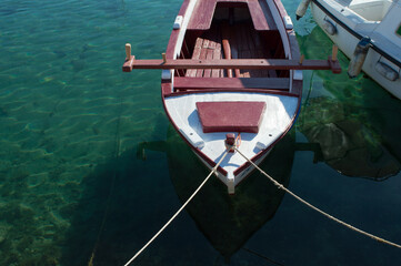 Fototapeta na wymiar Traditional small wooden fishing boat moored in marina, in Bibinje, Croatia