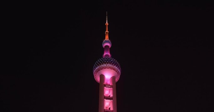 China - January 2019 - Shanghai Pearl Tower summitv purple lighted sparkling in the night