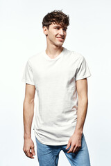 Obraz premium Portrait of handsome man in white t-shirt isolated on white background