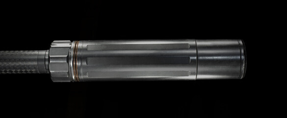 Side view of a silencer on black