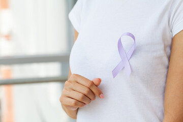 Woman with blue ribbon, prostate cancer awareness