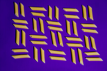abstraction background vector pasta sticks on the bright purple background 