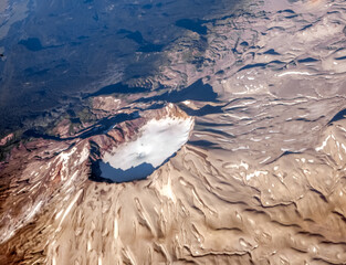 Dramatic aerial view of snow capped volcanos in the Andes mountains of the Patagonia, Chile