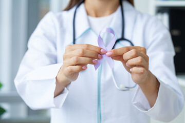 Woman with blue ribbon, prostate cancer awareness