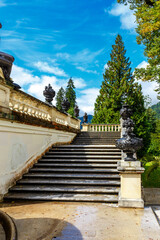 Fototapeta na wymiar Flight of stone stairs with ornamental garden urns
