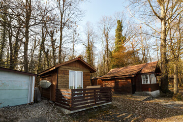 Fototapeta na wymiar Rustic wooden cabin in autumn woodland