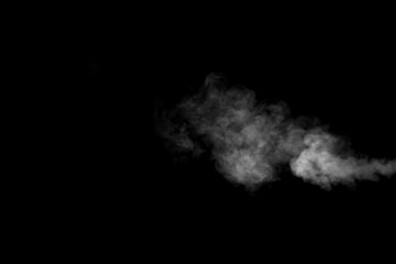 Fototapeta na wymiar A swirling horizontal vapor isolated on a black background for overlaying on your photos. Fragment of horizontal steam