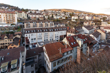 Fototapeta premium Rooftop view over a town at sunrise