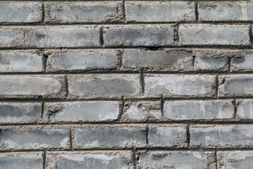 Brick wall. Brick texture. Brick background. The process of making a concrete wall.