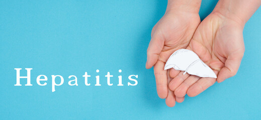 World hepatitis day, hands holding a liver, organ disease, health care
