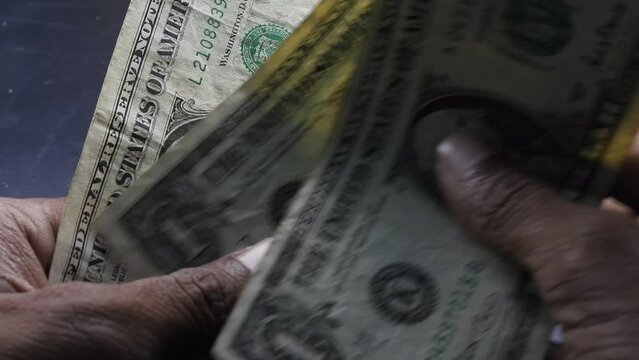 Three one dollar bills Counting poor man