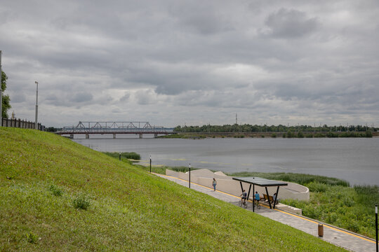 Views of the city of Syzran, Samara region, Russia. Summer cloudy weather. City park and railway bridge.
