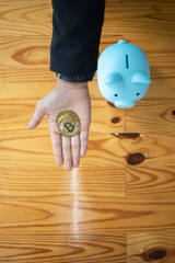 young investor holding a coin cryptocurrencies Bitcoin in hand with confidence in the coin...