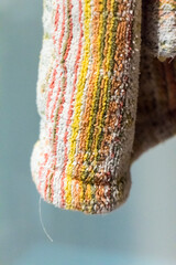 Colorful striped towel hanging in a bathroom