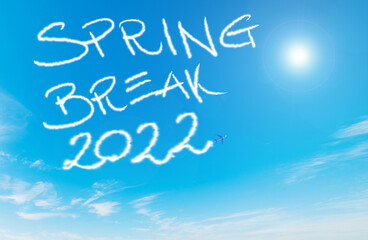 Naklejka na ściany i meble Spring break 2022 written by contrails in the blue sky