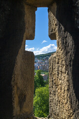 Cross shaped opening in a stone castle wall