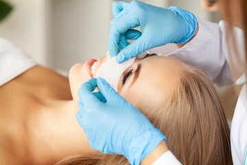 Beautiful Woman with long eyelashes in a beauty salon