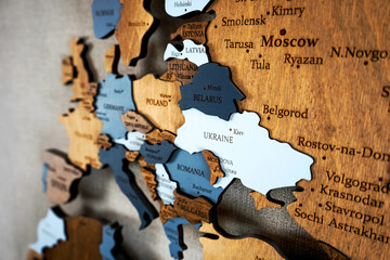 Europa on the political map. Wooden world map on the wall. Ukraine, Belarus, Poland and other...