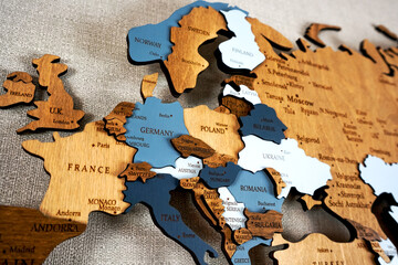 Europa on the political map. Wooden world map on the wall. Ukraine, Belarus, Poland and other...
