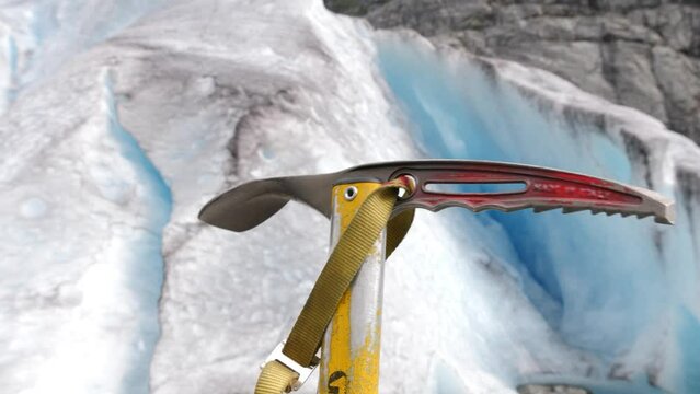 Closeup of an ice axe on the glacier