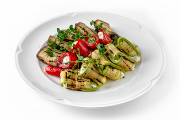 Envelopes of zucchini and eggplant stuffed with cheese, grilled vegetables with nuts and herbs on a...
