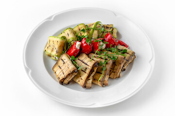 Envelopes of zucchini and eggplant stuffed with cheese, grilled vegetables with nuts and herbs on a...