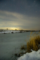  forest in the night . Night landscape. Nightsky and clouds . Stars in the sky . Lights of the city . 