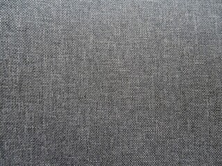 Fototapeta na wymiar Gray background in textile, seat cover.