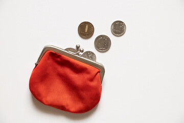 Russian ruble with a purse lie on a white background. Financial sanctions against Russia. The...