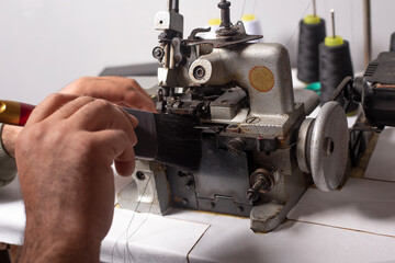 cleaning the sewing machine with a brush