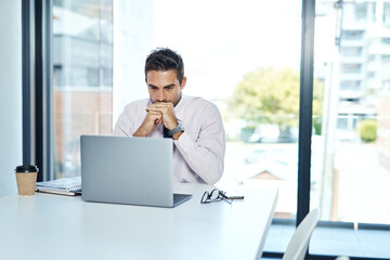 Focus and discipline have always been critical to success. Cropped shot of a businessman sitting...