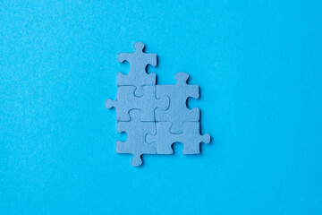 Blue jigsaw puzzle pieces. Top view composition