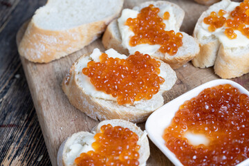 natural red salmon caviar with baguette and butter