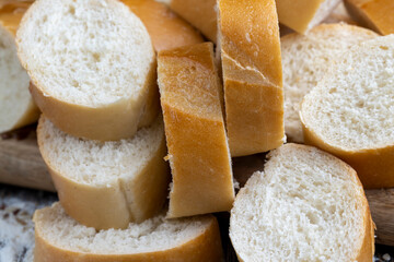 pieces of wheat baguette on a cutting board