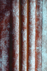 Texture of fabric with large folds and texture of red and white