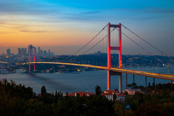 Fototapeta na wymiar Istanbul view at sunset. Bosphorus Bridge or 15 temmuz sehitler koprusu