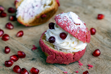 red cranberry-flavored cake with cranberry berries and creamy milk filling